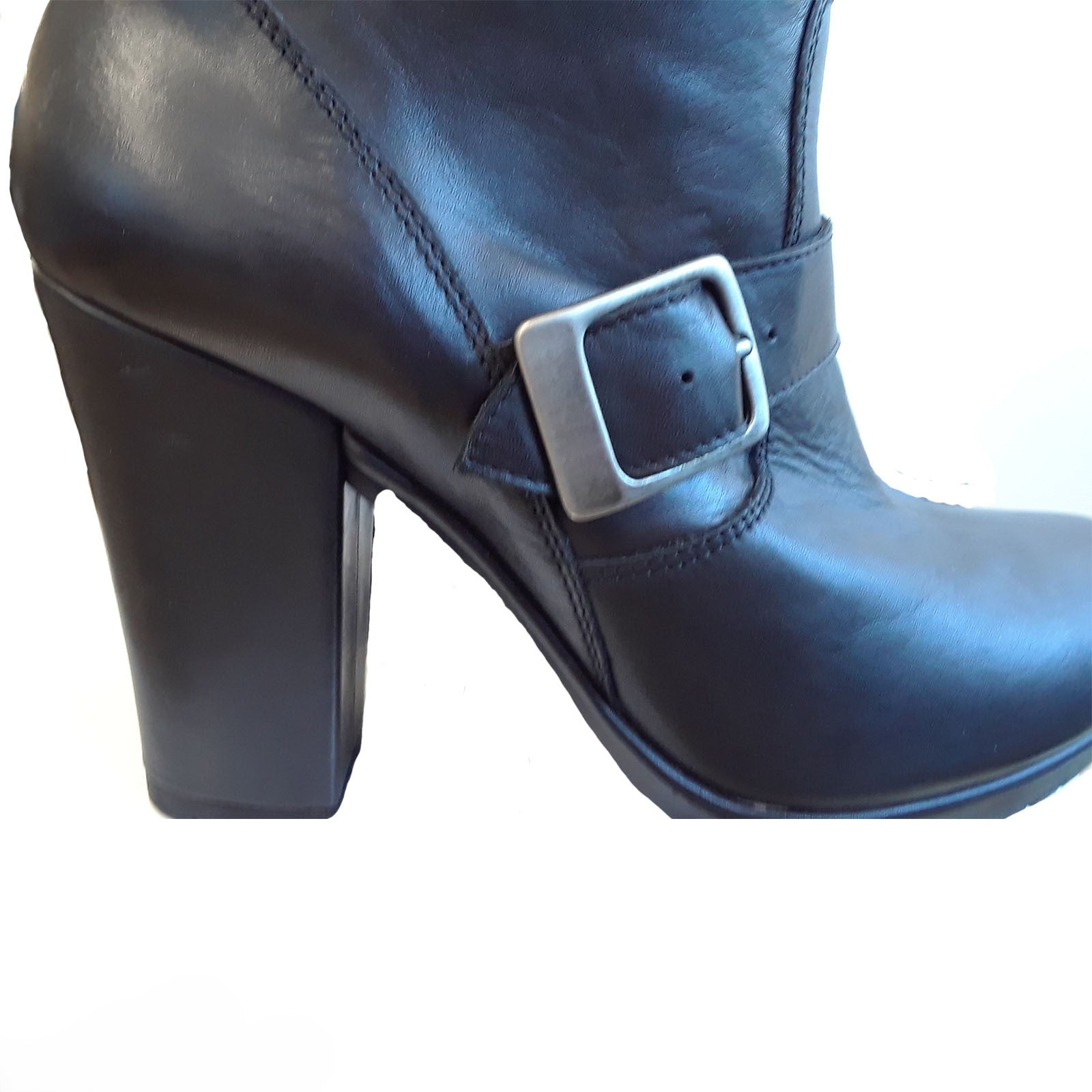 Black leather boot with a silver buckle on a white background