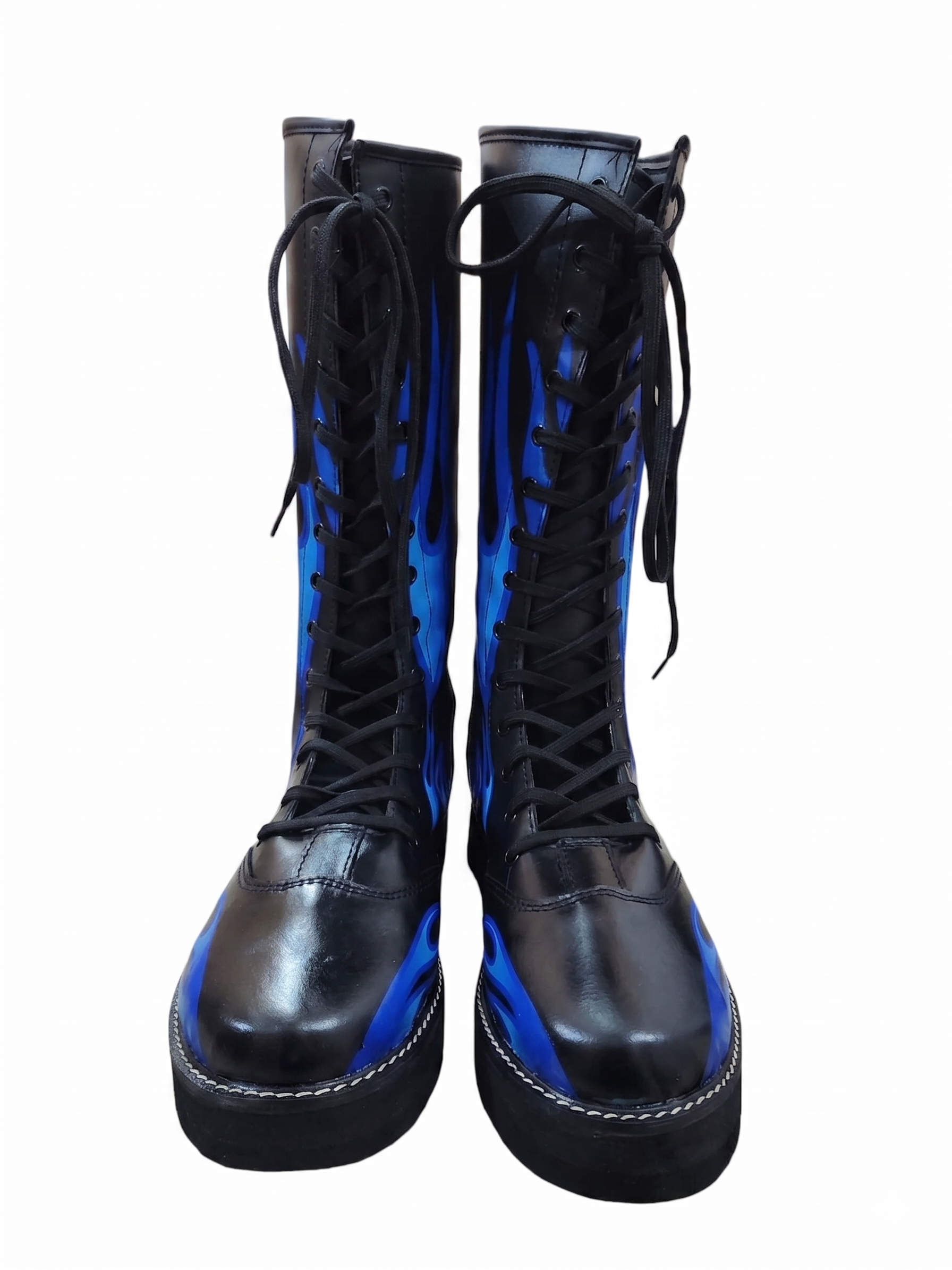 Front-facing pair of black inferno wrestling boots displaying vivid blue flame artwork covering both shaft panels 