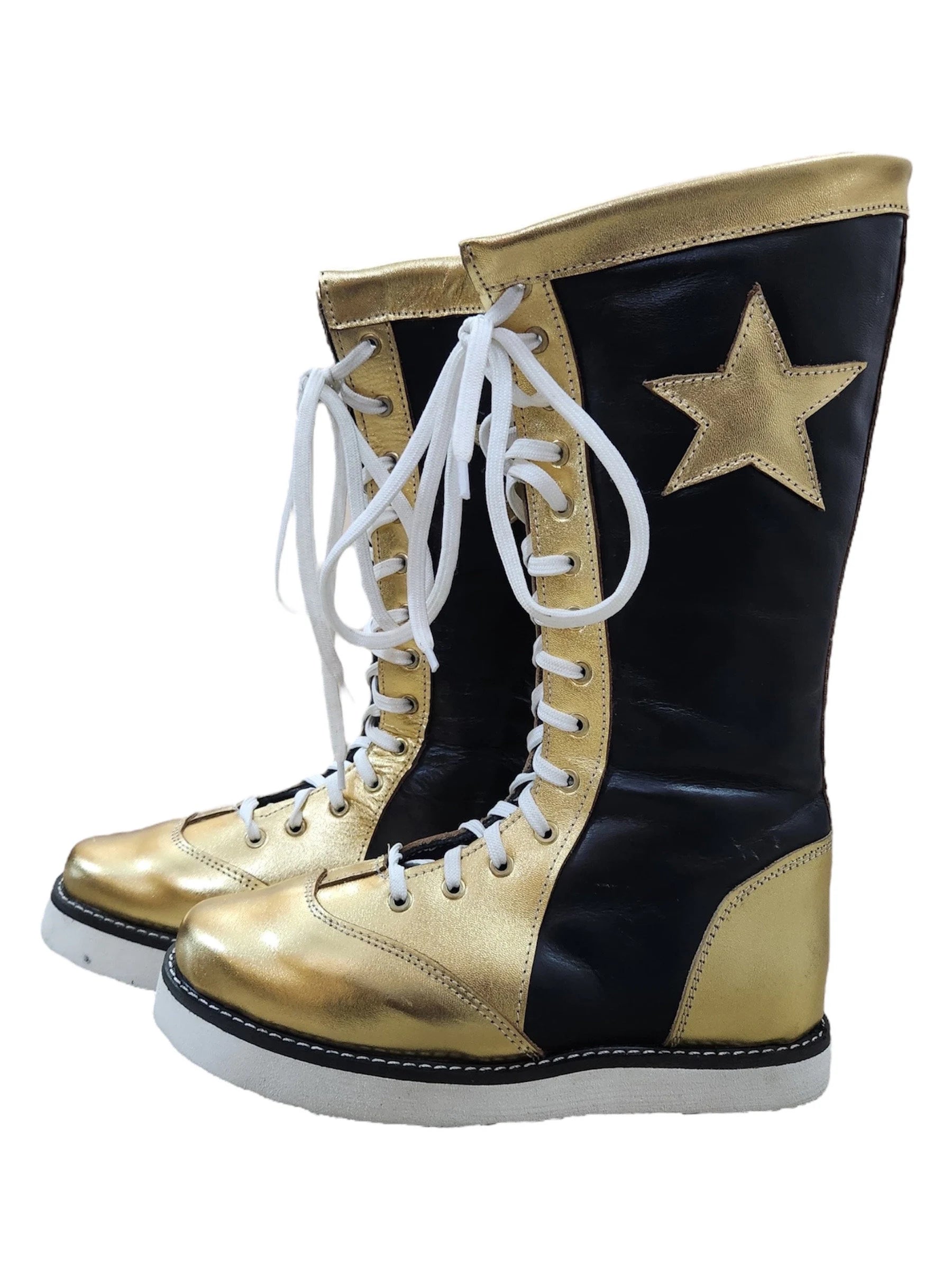 Black and gold combat boots with a star on a white background
