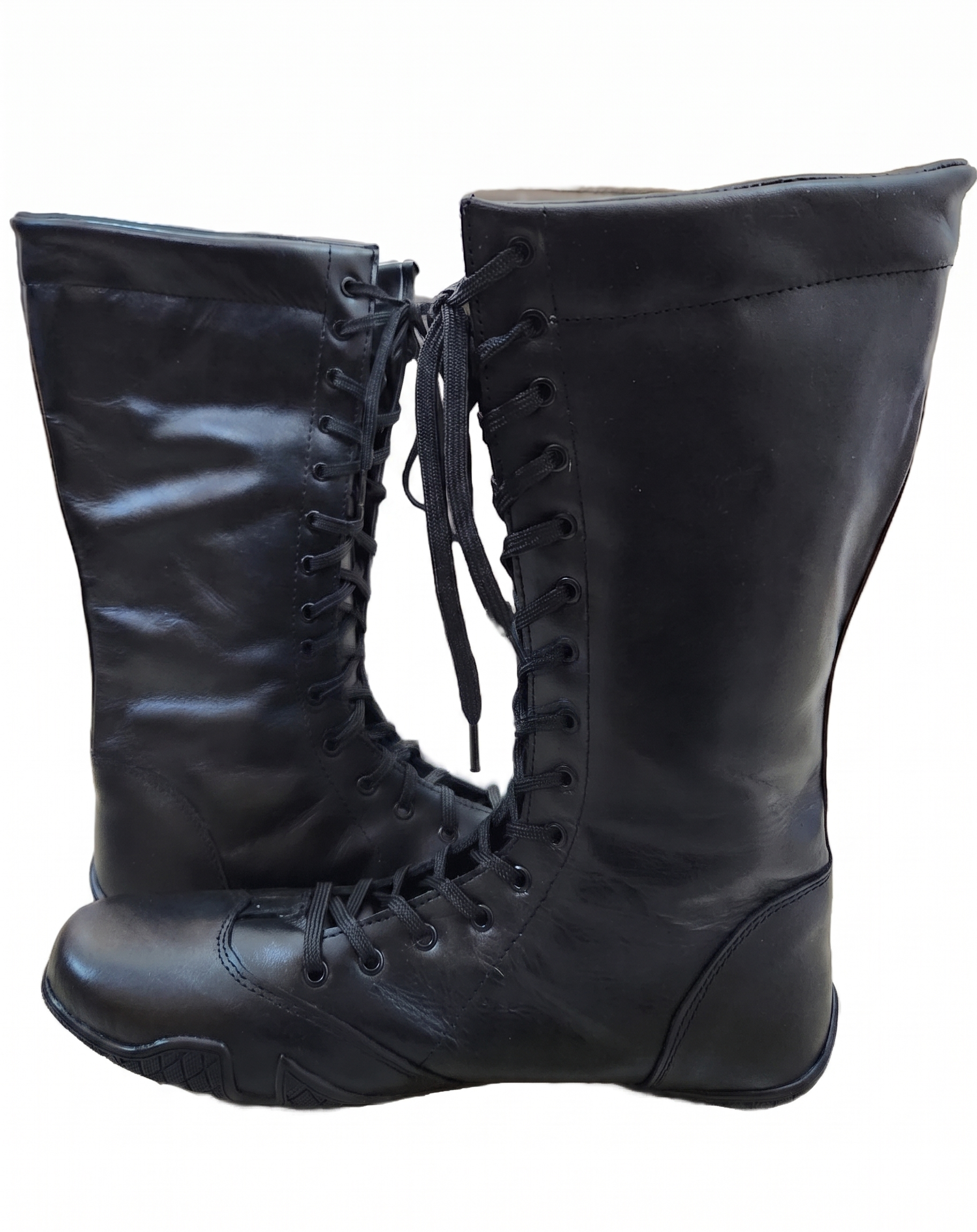 Unisex black leather dark champion wrestling boots with white star accent, flat black athletic rubber sole, and stitched welt construction on white background
