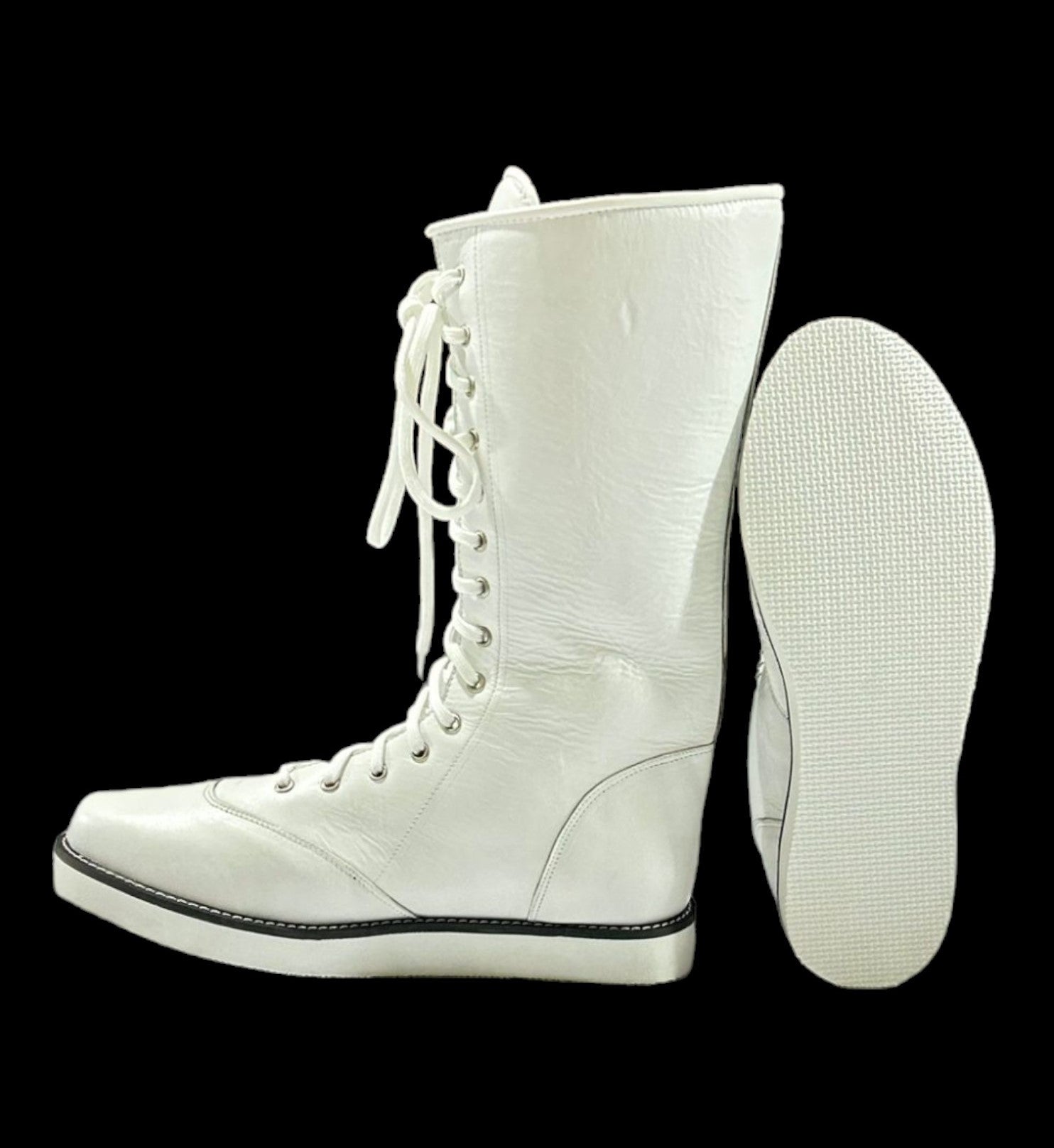 White lace-up wedge heel boot on a black background