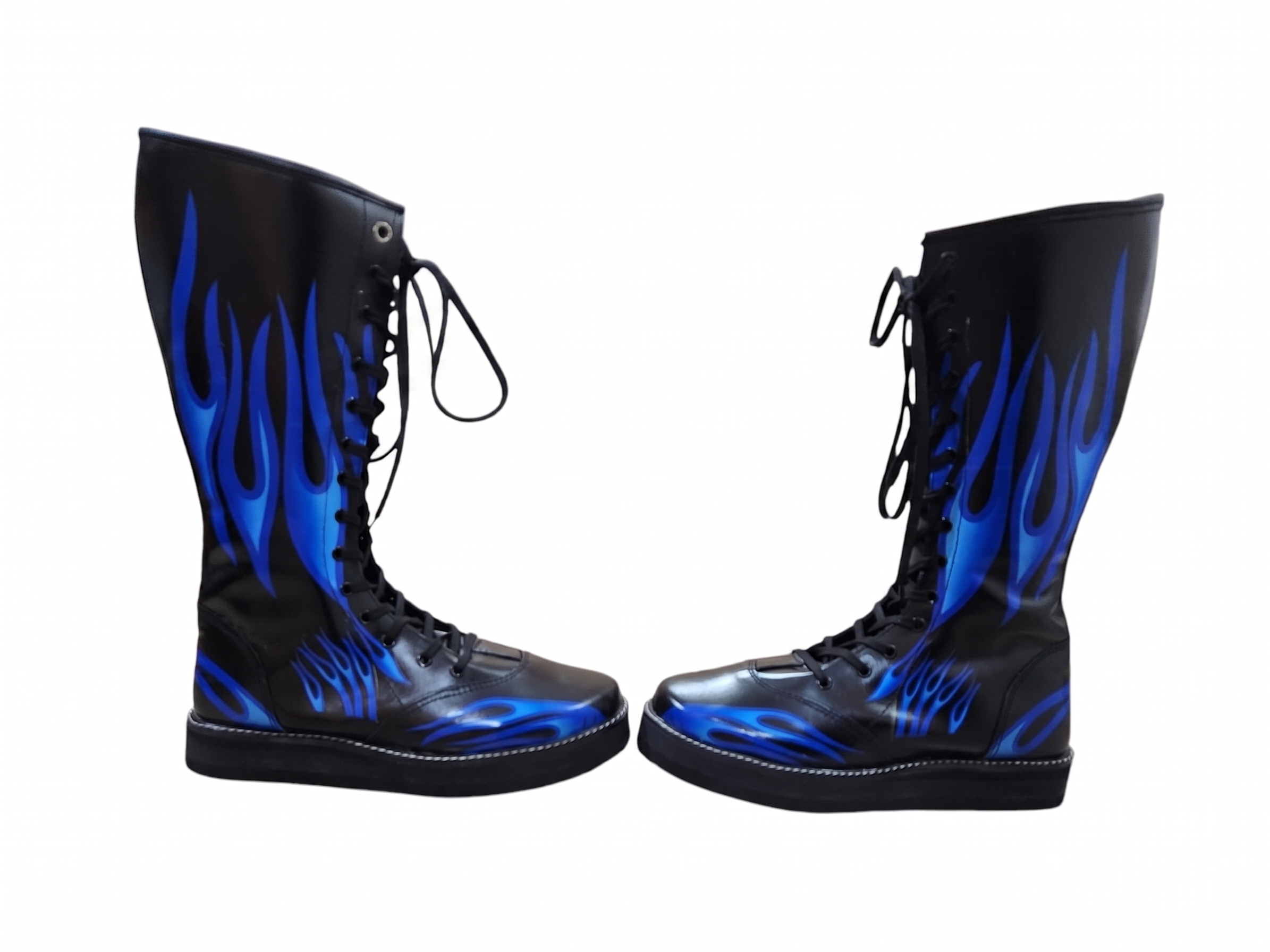 Close-up of electric blue flame gradient print detail on black leather wrestling boot shaft showing layered tapering flame tongues