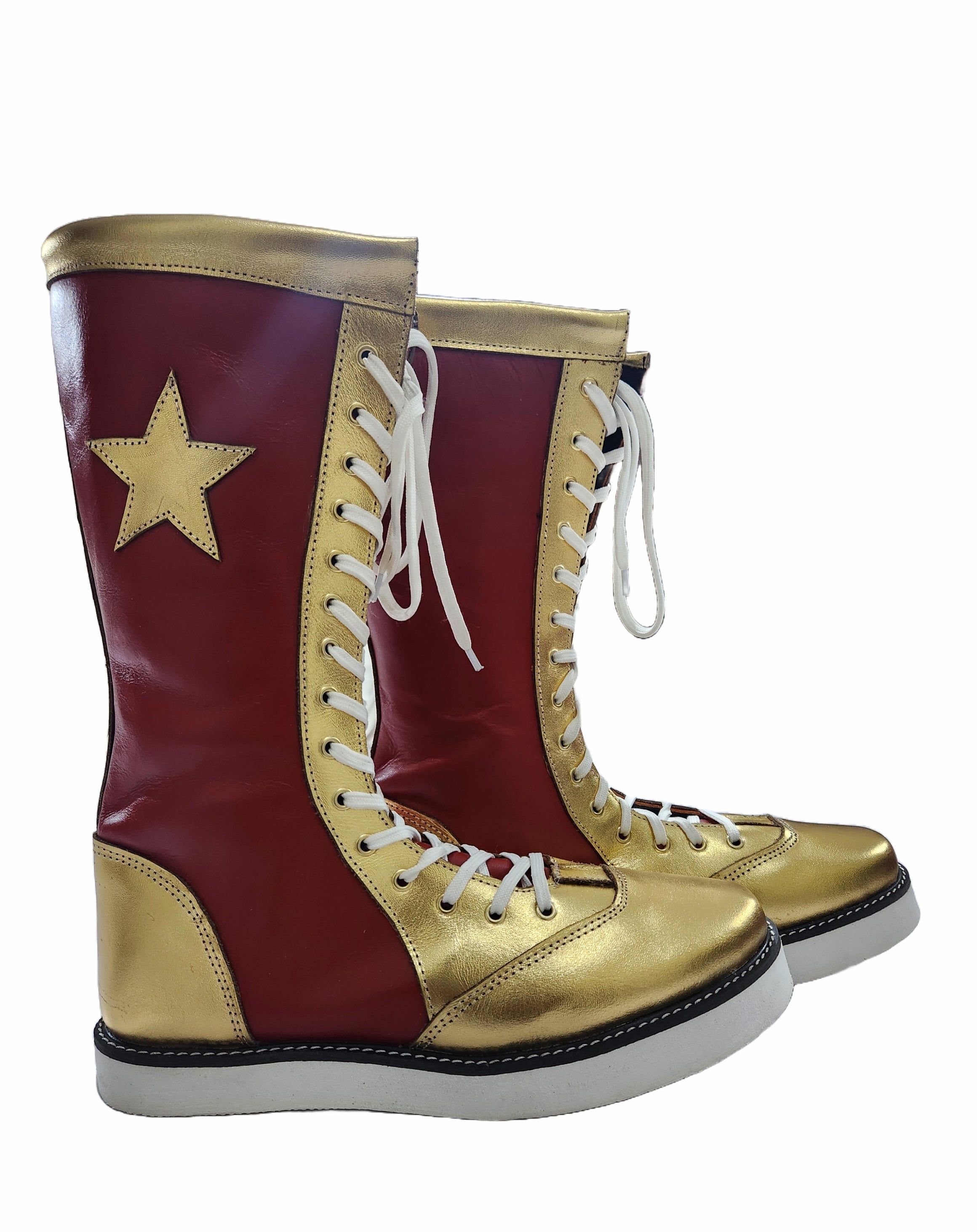 Bottom angle of red and gold champion wrestling boots displaying white rubber athletic sole and black stitched welt construction