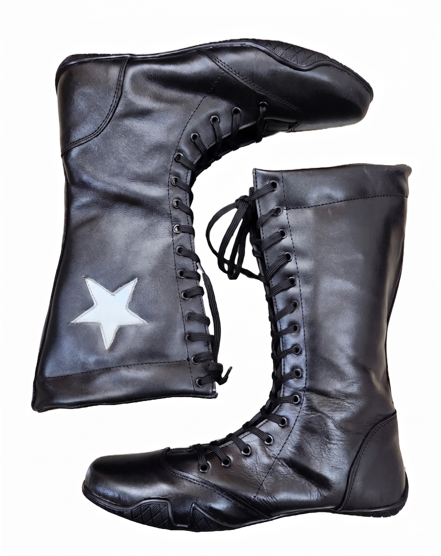 Close-up of white star appliqué patch precision-stitched onto black leather wrestling boot 