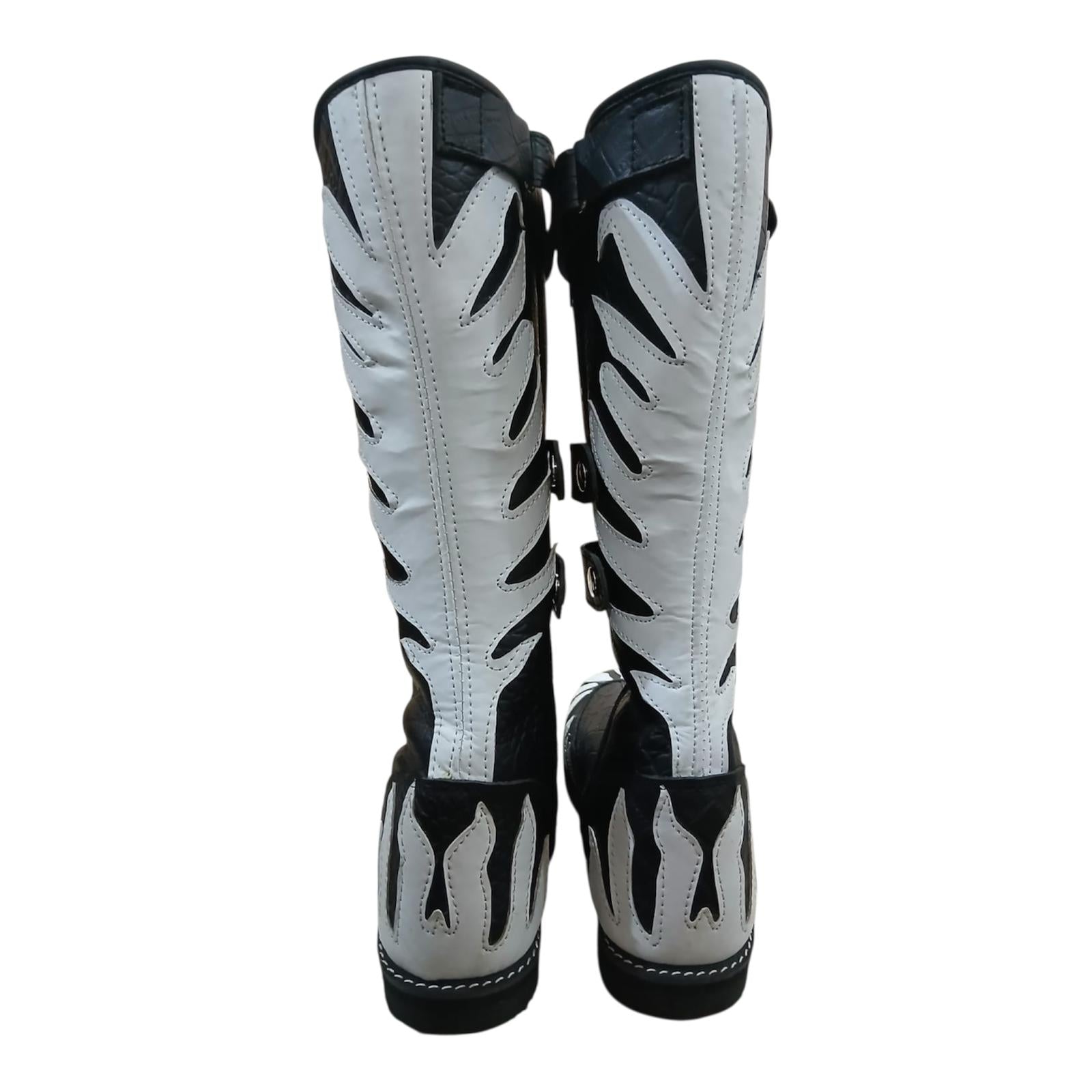 Top-down view of black Top-down view of black and white wrestling boots