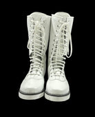 White lace-up boots on a black background