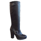 Black knee-high boot with a buckle on a white background