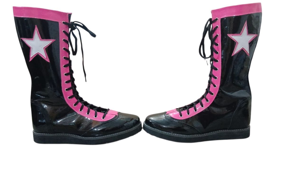 Pair of knee-high lace-up wrestling boots designed for ring performance
