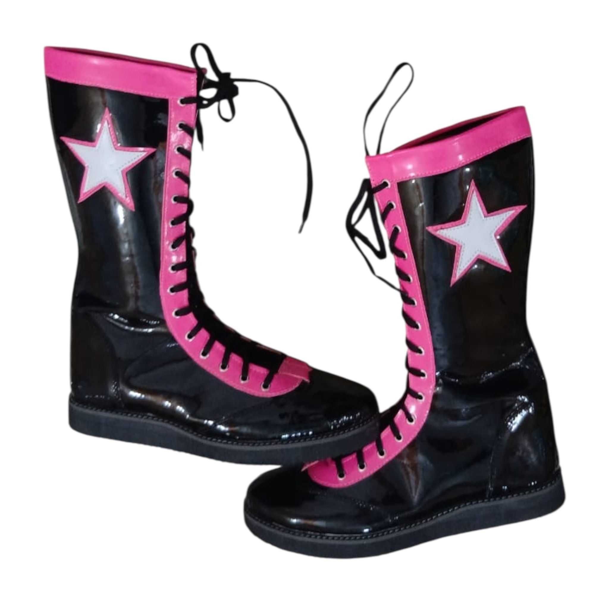 Glossy black professional wrestling boots featuring pink trim and white star patches
