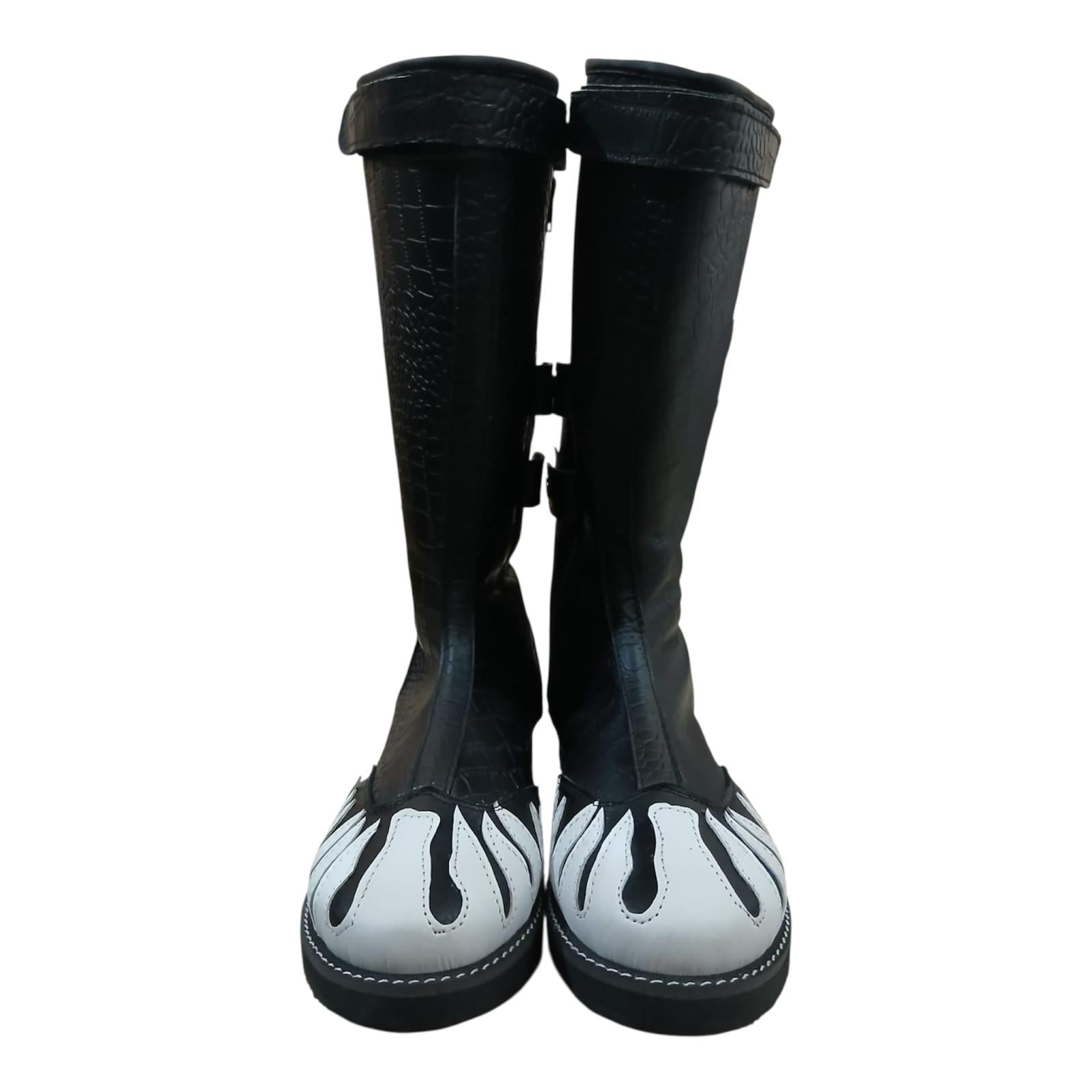 Unisex knee-high professional wrestling boots with flat rubber athletic sole and stitched welt construction
