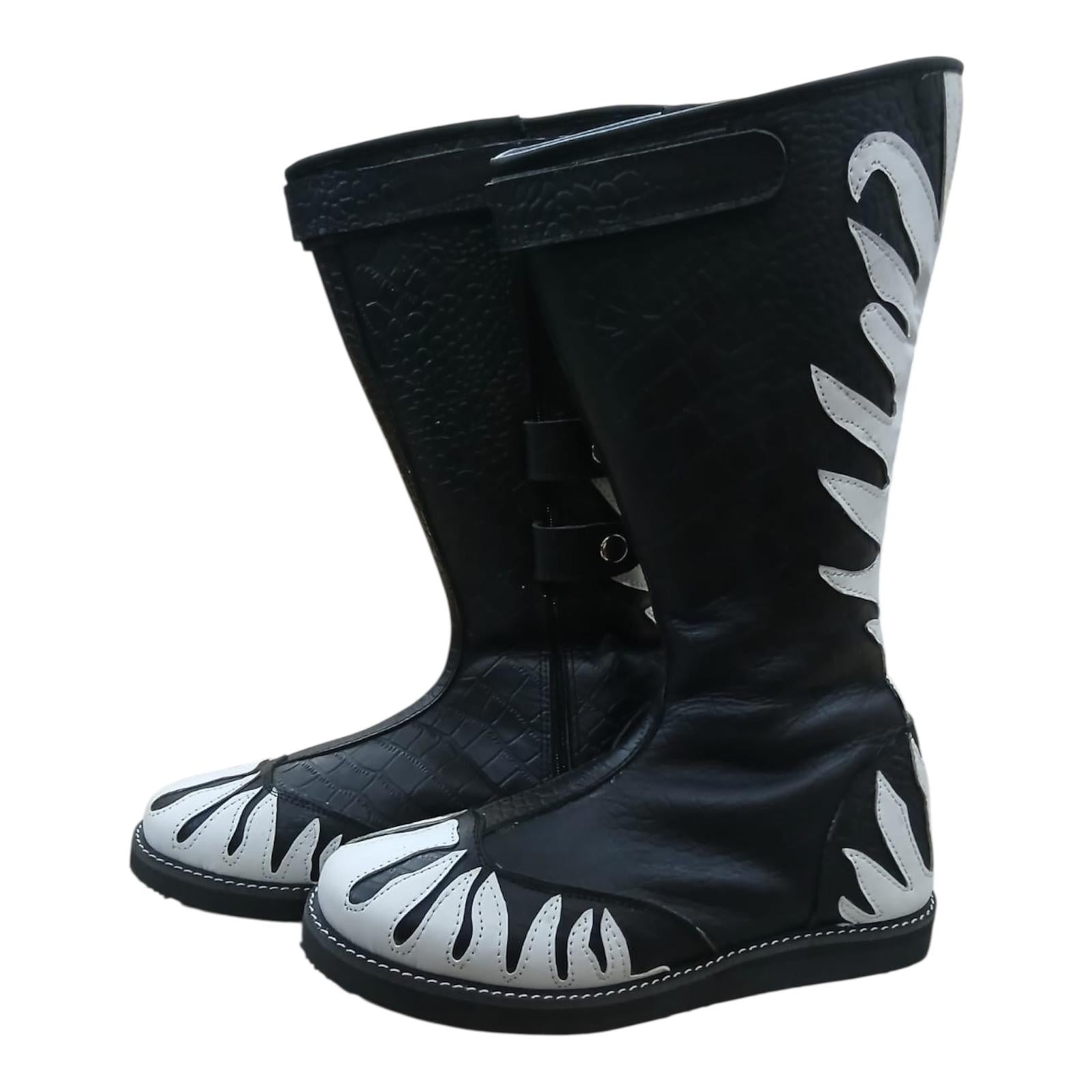 Top-down view of black and white wrestling boots showing white flame overlay pattern and structured toe box