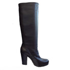 Black knee-high boot on a white background