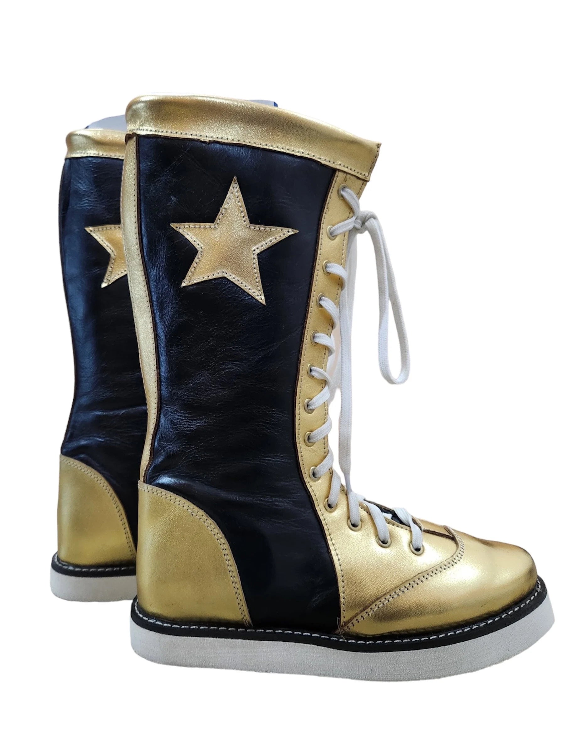 Black and gold boots with a star design on a white background