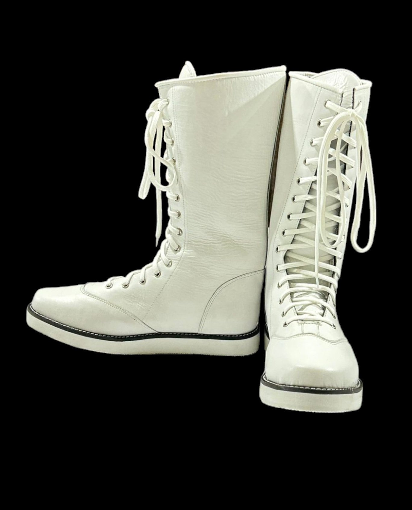 Front view of white knee-high ring boots for wrestling performance
