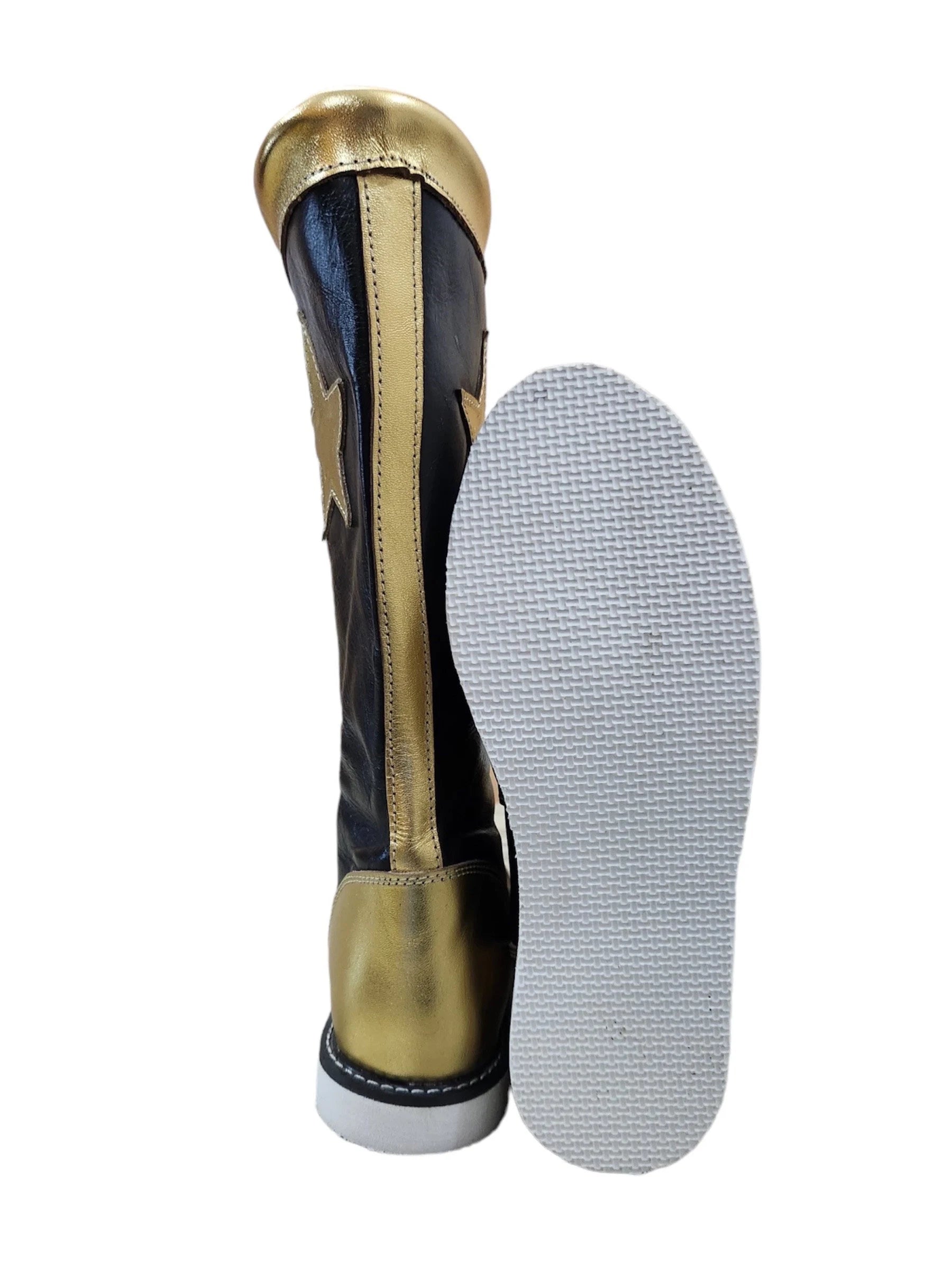 Gold and black shin guard with a white sole on a white background