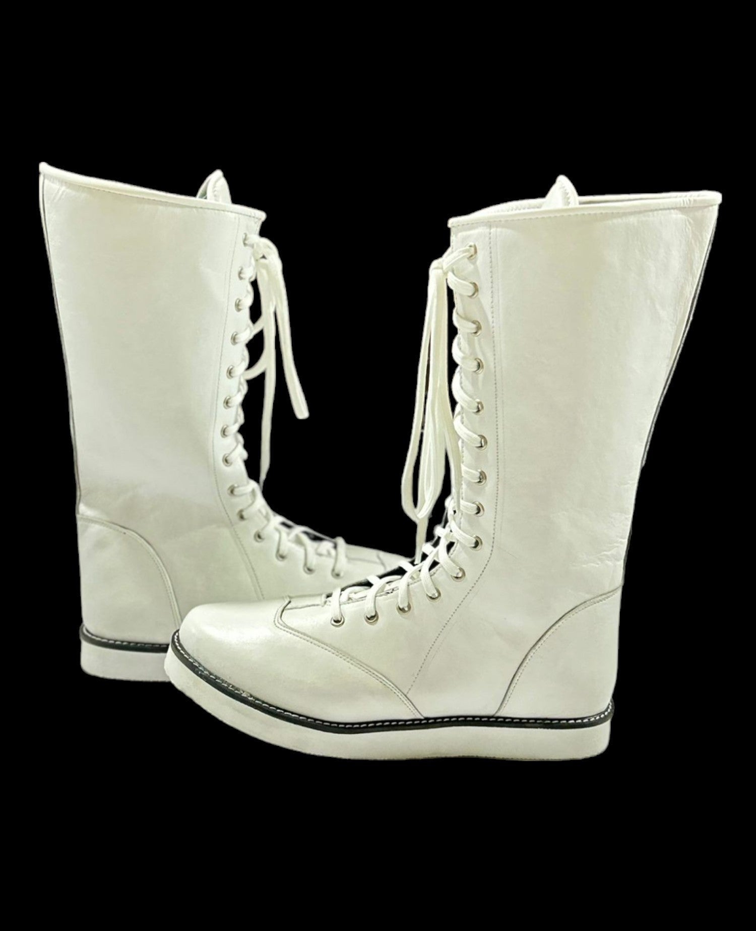 Pair of white boots featuring full-length flat laces and silver eyelet hardware
