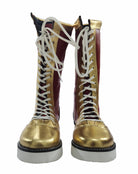 Pair of gold and maroon boots with white laces on a white background