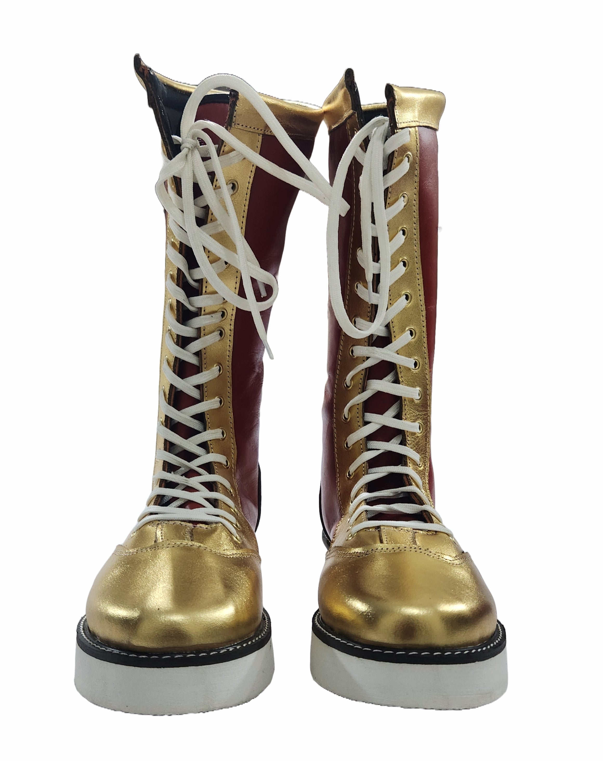 Pair of gold and maroon boots with white laces on a white background