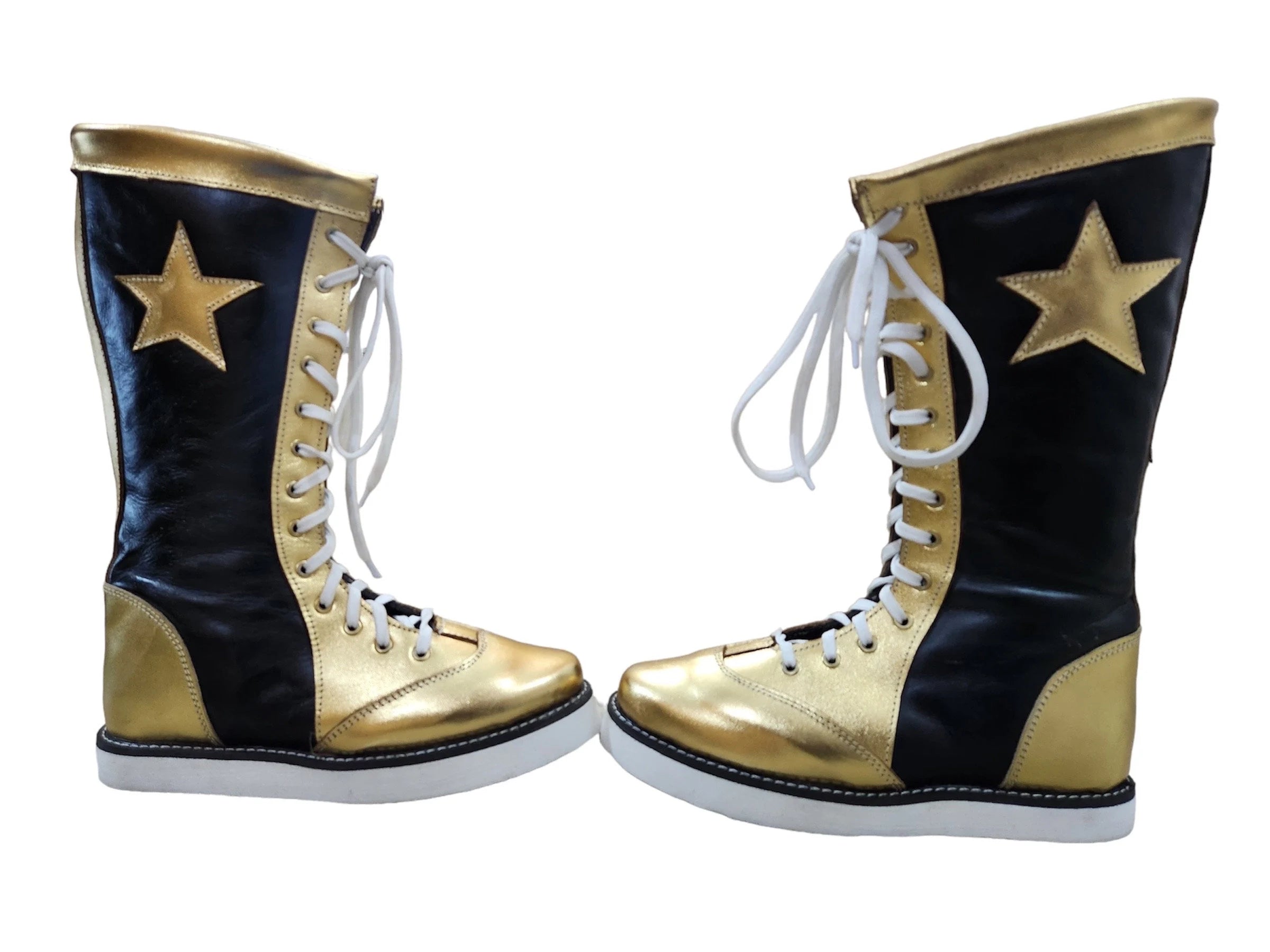 Pair of black and gold high-top sneakers with white stars on a white background