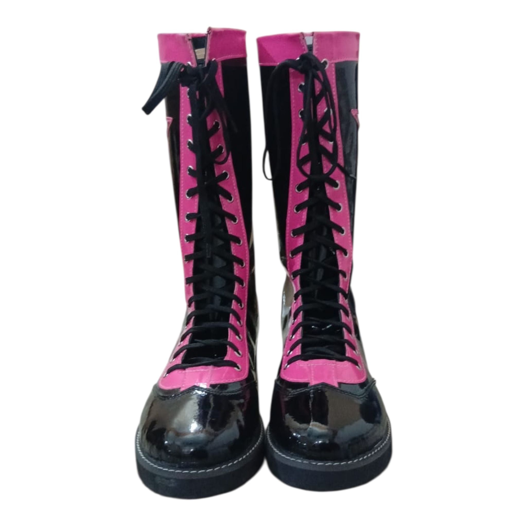 Black and pink combat boots with glossy finish on a white background