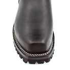 Top-down view of black tall shaft engineer boots showing wide mouth collar opening, rear pull tab, and cross-stitch heritage badge patch on outer shaft