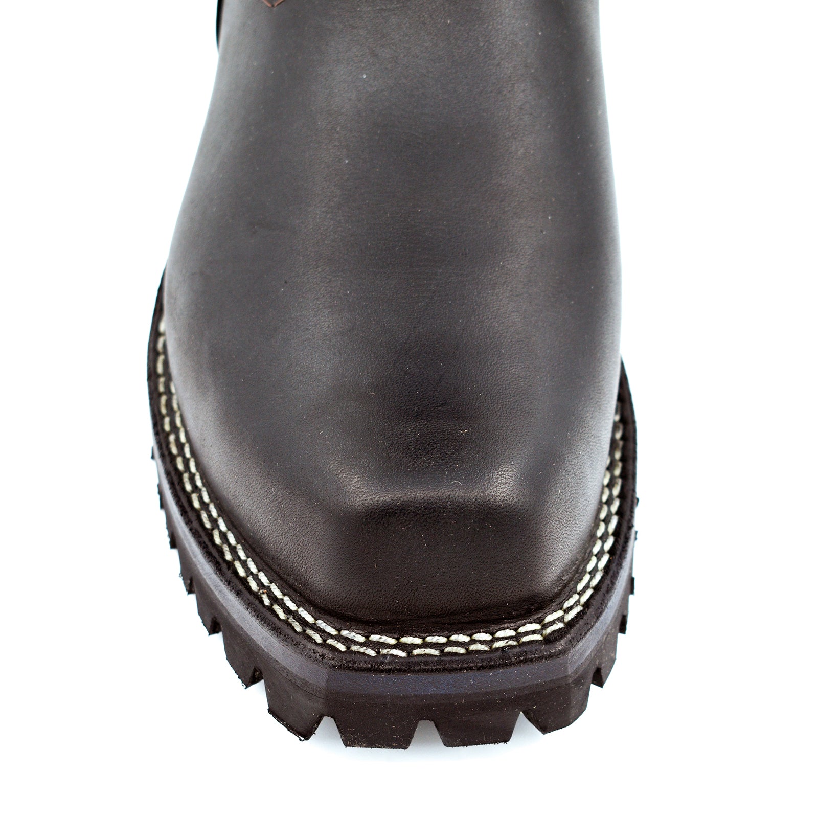 Top-down view of black tall shaft engineer boots showing wide mouth collar opening, rear pull tab, and cross-stitch heritage badge patch on outer shaft
