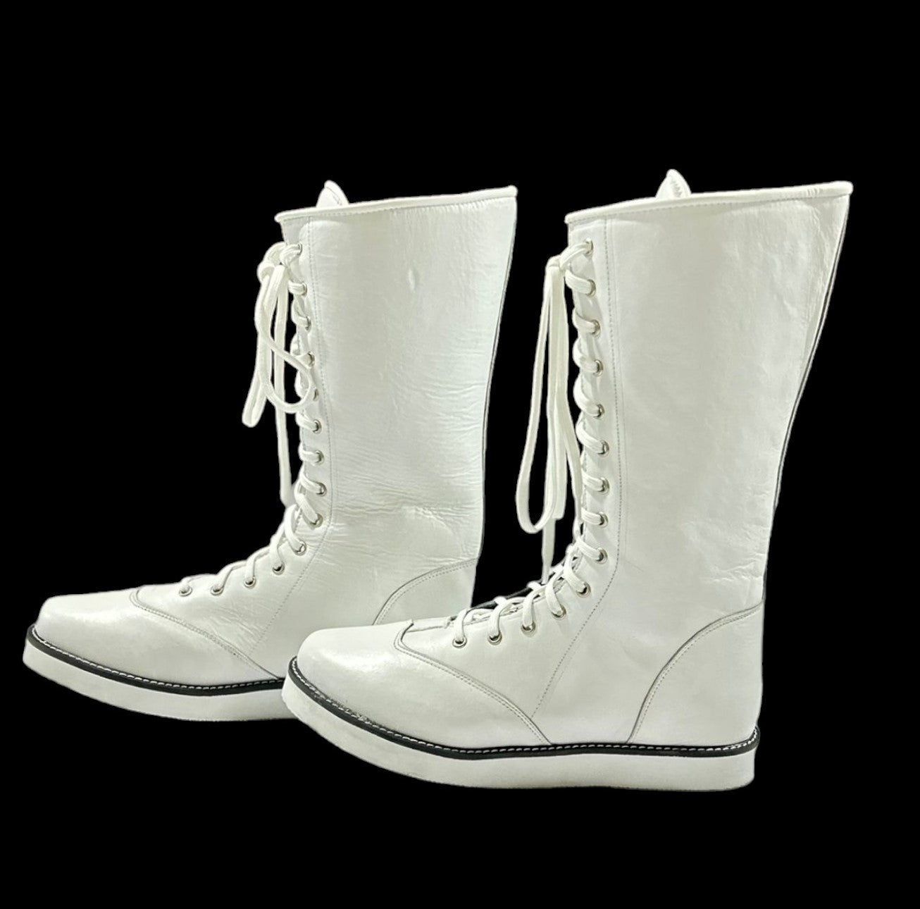 White professional lace-up wrestling boots with knee-high athletic design

